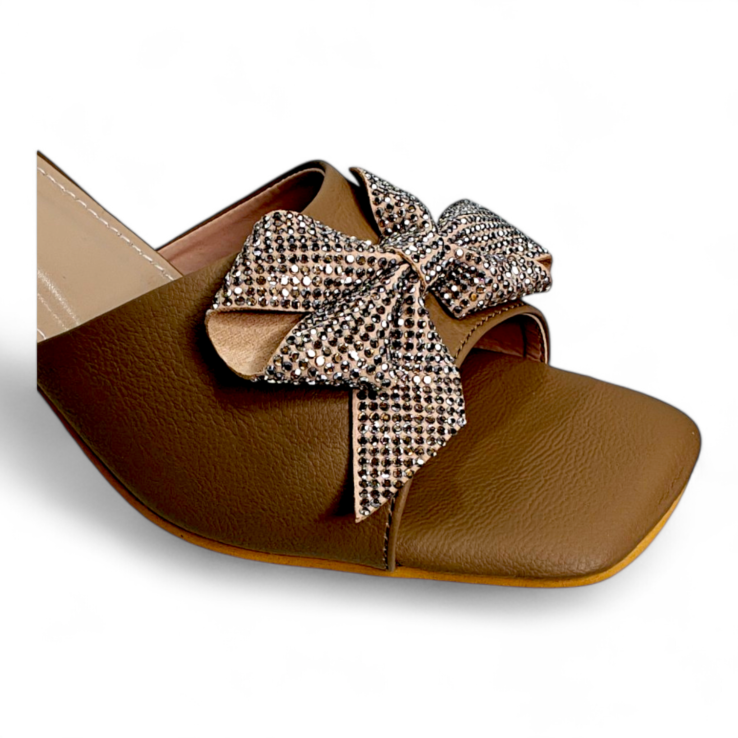 Close-up of Embellished Bow on Transparent Heel Open Toe Footwear in Tan and Gold