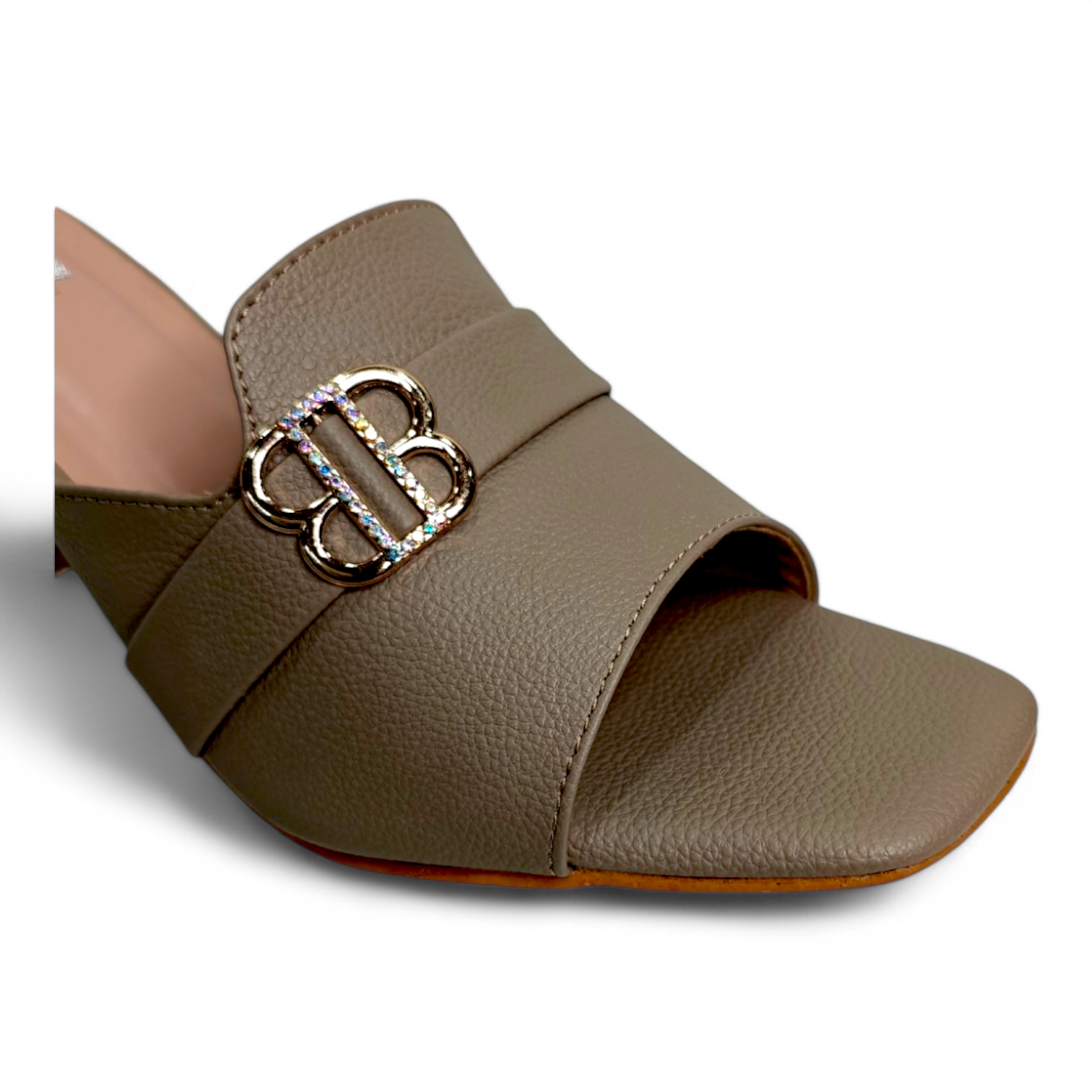 Close-up of the buckle detail on brown block heel open toe footwear