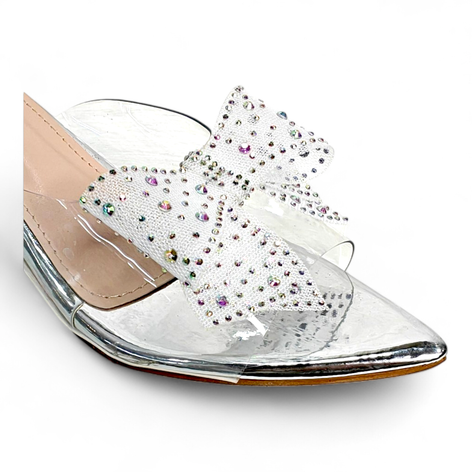 Close-up of the embellished net bow and transparent belt on silver heels