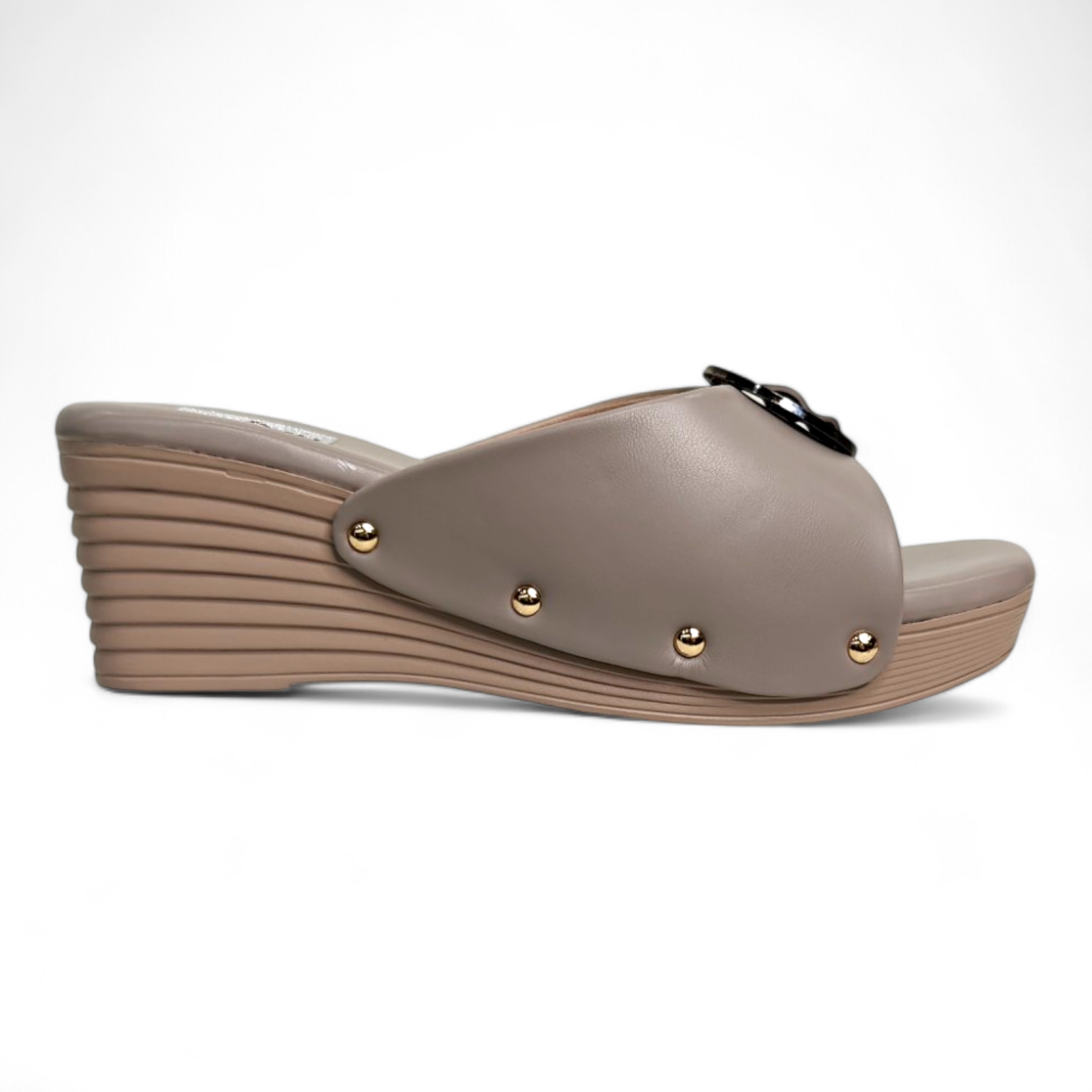 Side view of brown wedge heel with open toe and circle buckle embellishment