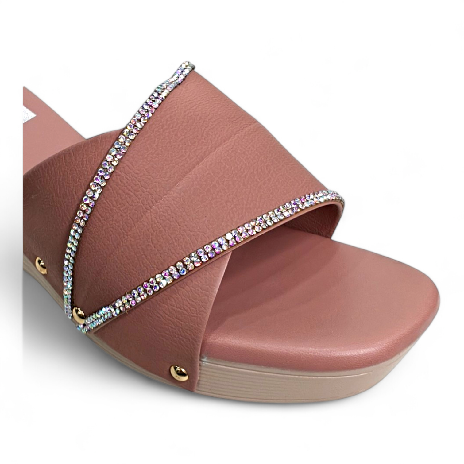 Close-up of cushioned sole and detailed embellishment on peach wedge heel footwear