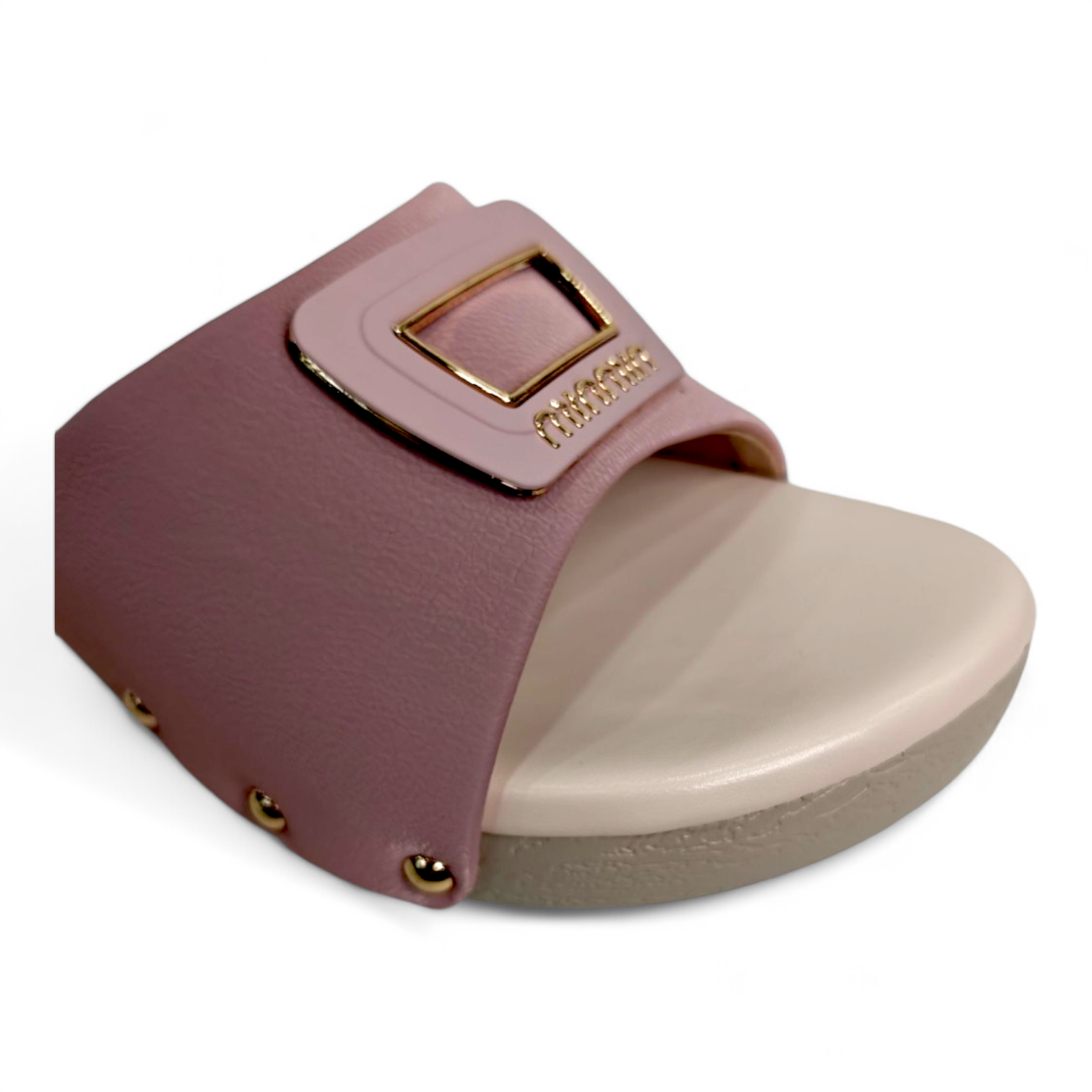 Close-up of square buckle detail on peach wedge heel footwear