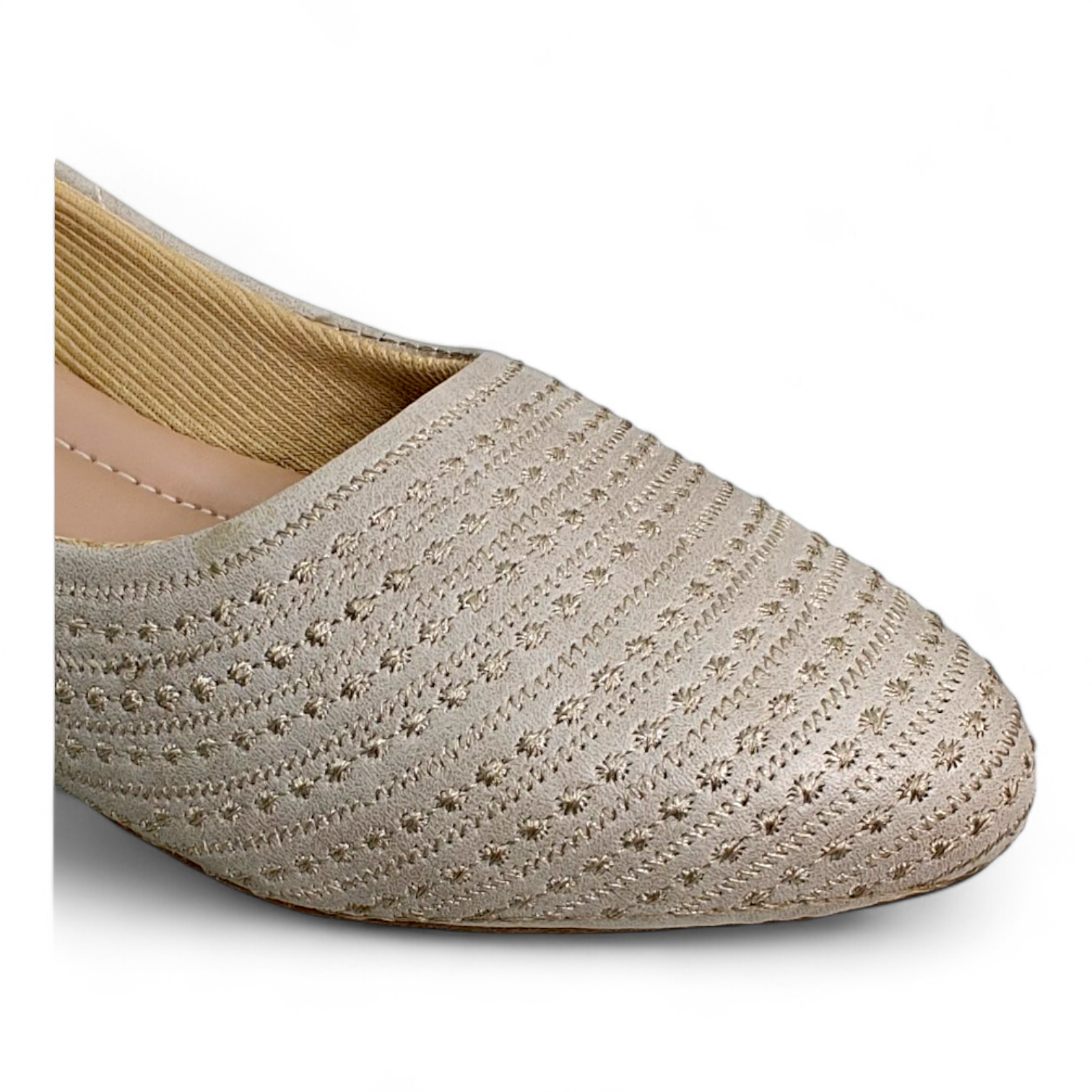 Close-up of soft cushion material and self lining on top of beige women's flat bellies