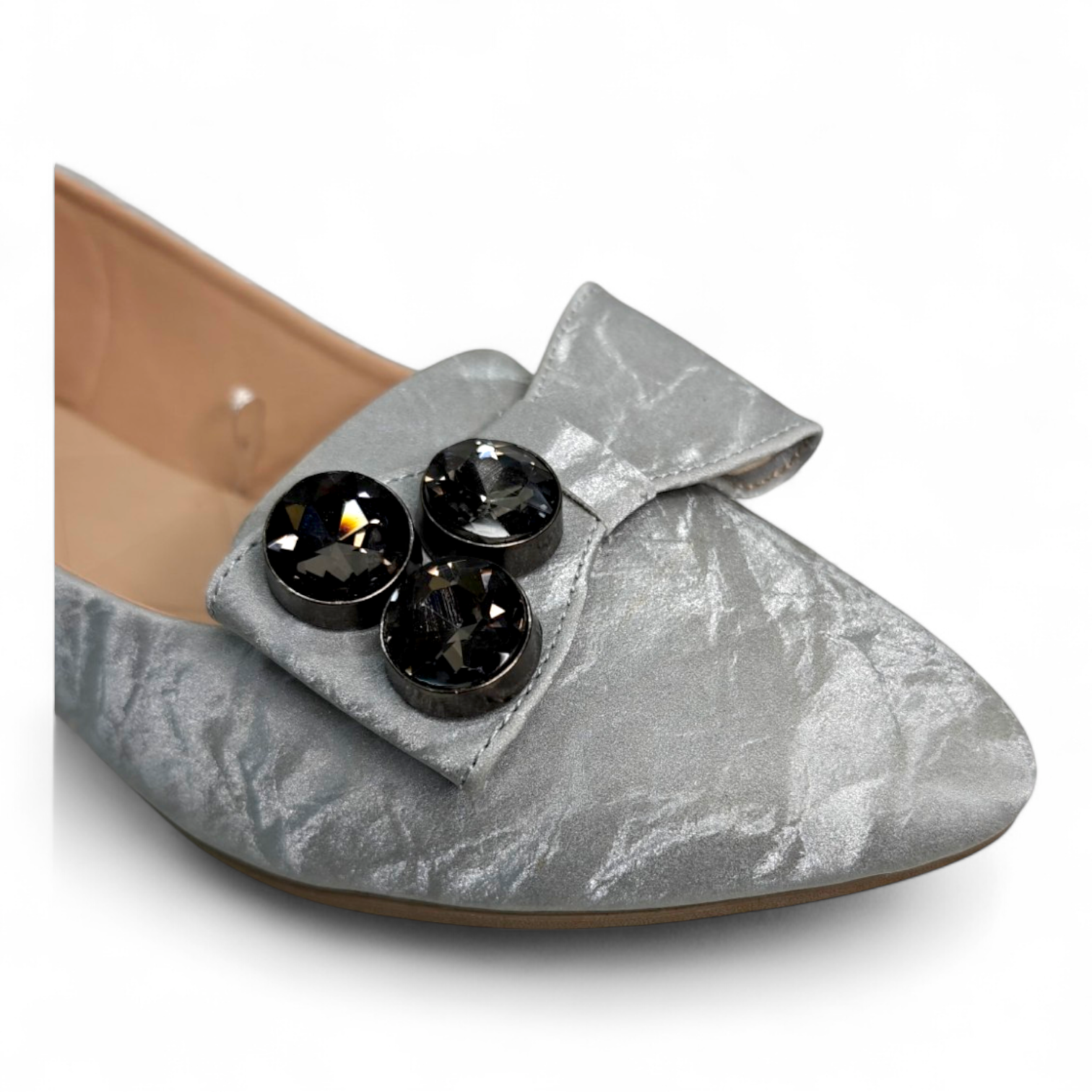 Close-up of the embellished shine and bowtie on Silver Flat Bellies for women