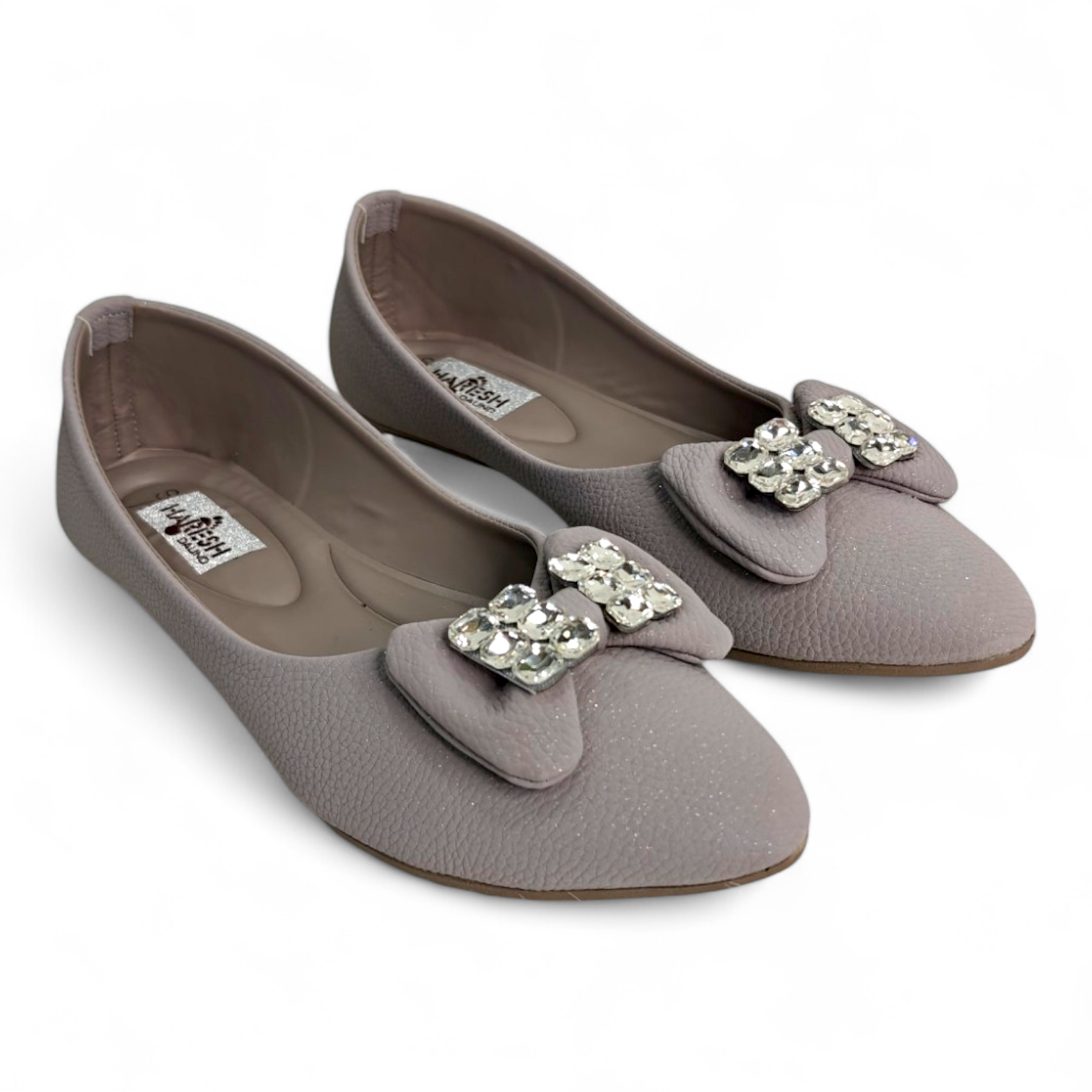 Top view of grey flat bellies with diamond-embellished bow and soft material