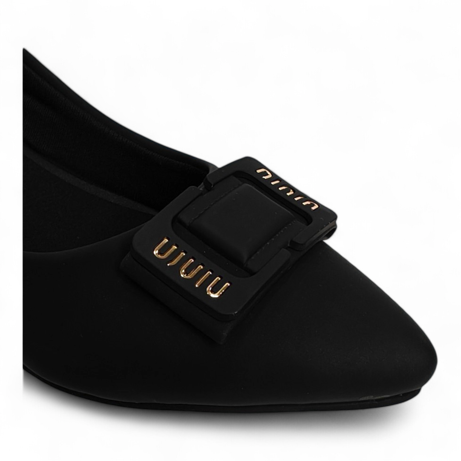 Close-up of square buckle detail on black matt finish box heel pumps