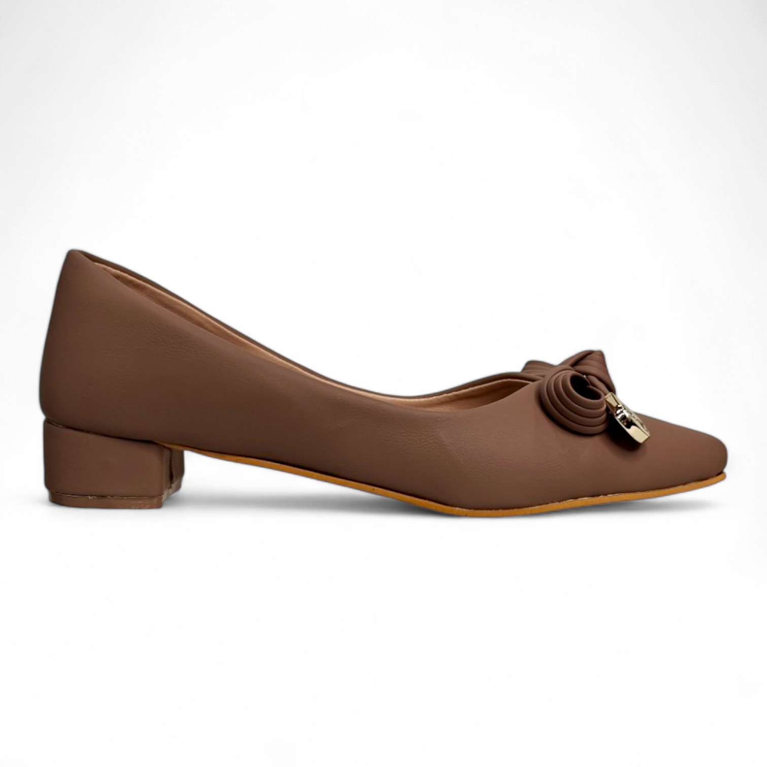 Side view of classy tan box heel pumps showcasing the elegant bow buckle detail