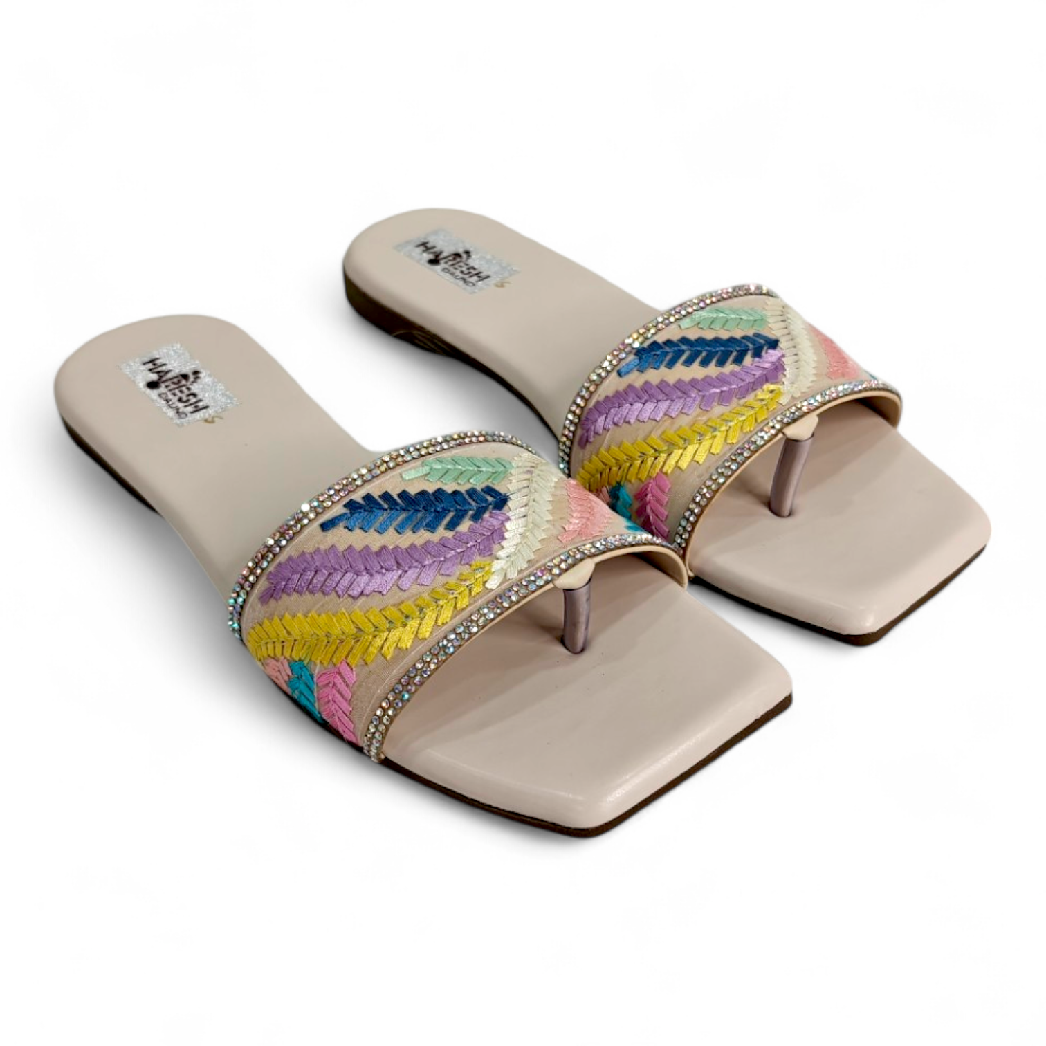 Top view of multi-color flats sliders with floral design and open toe