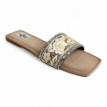 Beige flat sliders with floral design on top and open toe, perfect for casual wear