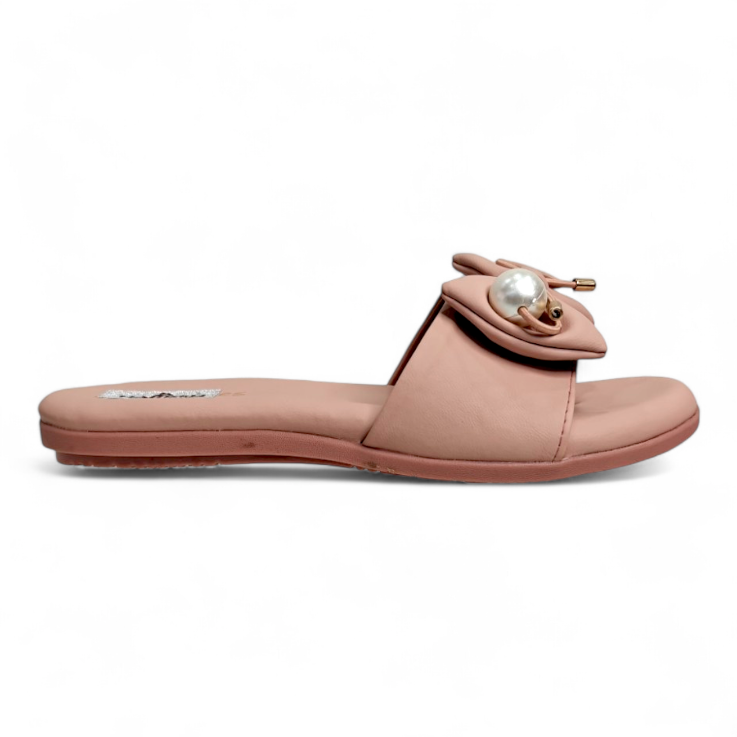 Side view of peach flats sliders, featuring a bow and pearl accent on top, open toe design