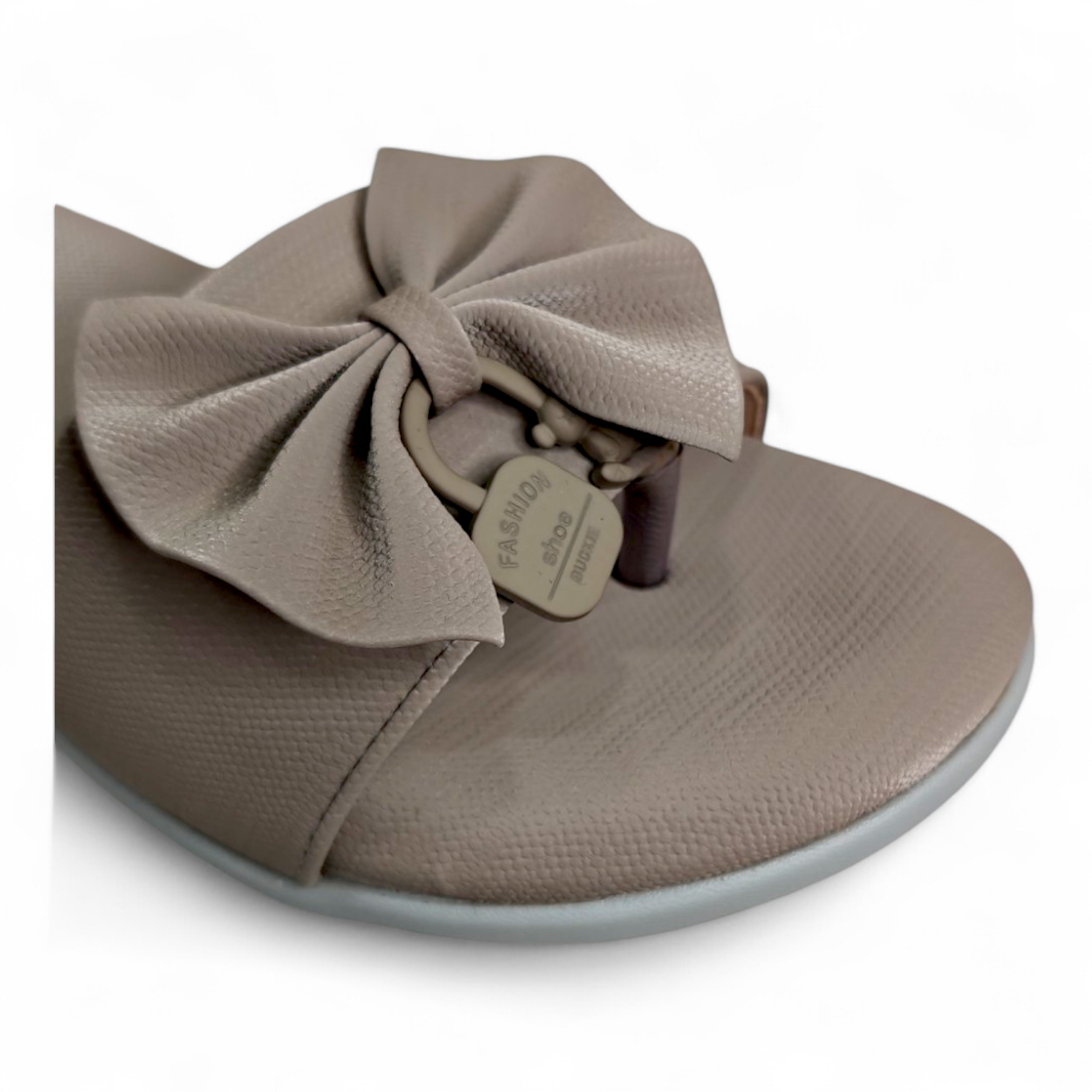 Close-up of the Bow Detail on Brown Flats Sliders with Toe Loop