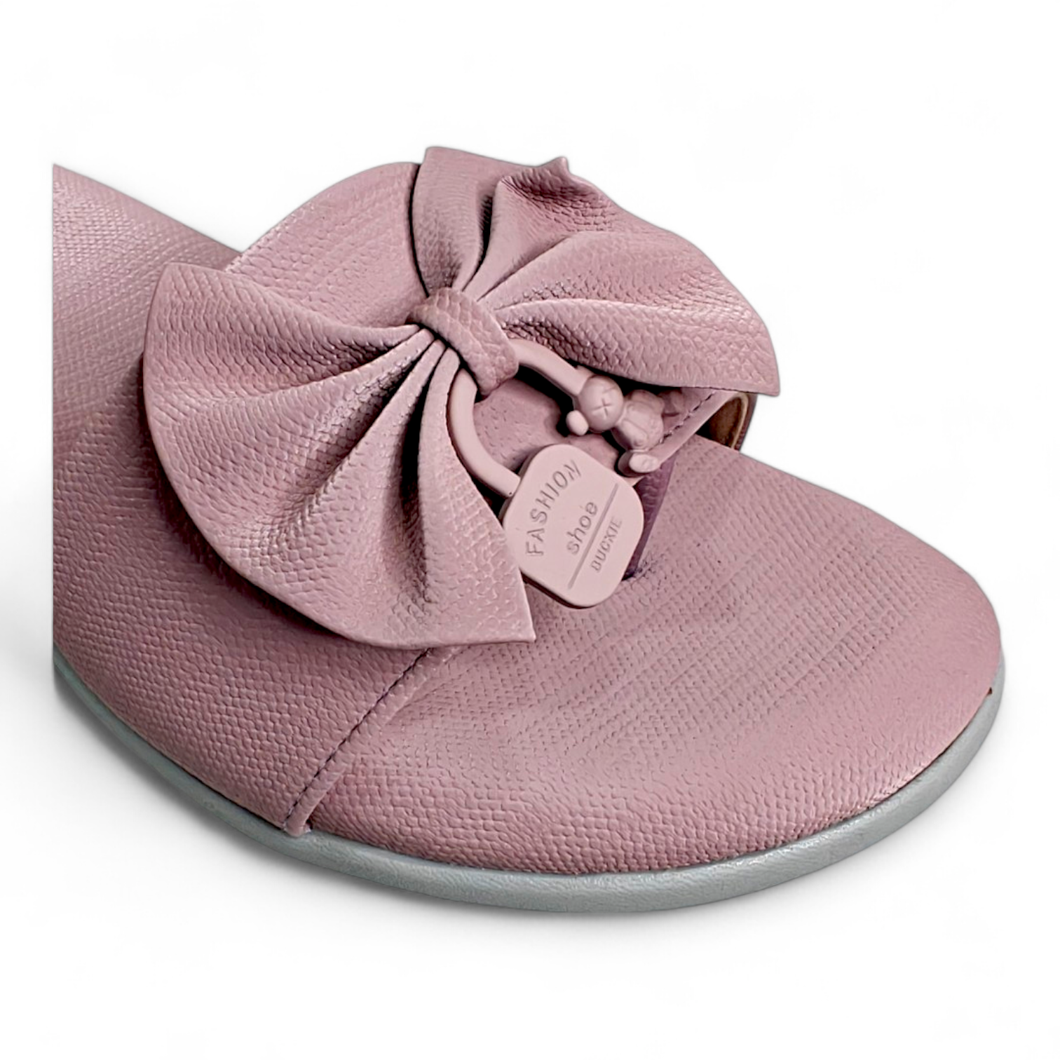 Close-up of the bow detail on lilac flats sliders with toe strap for women