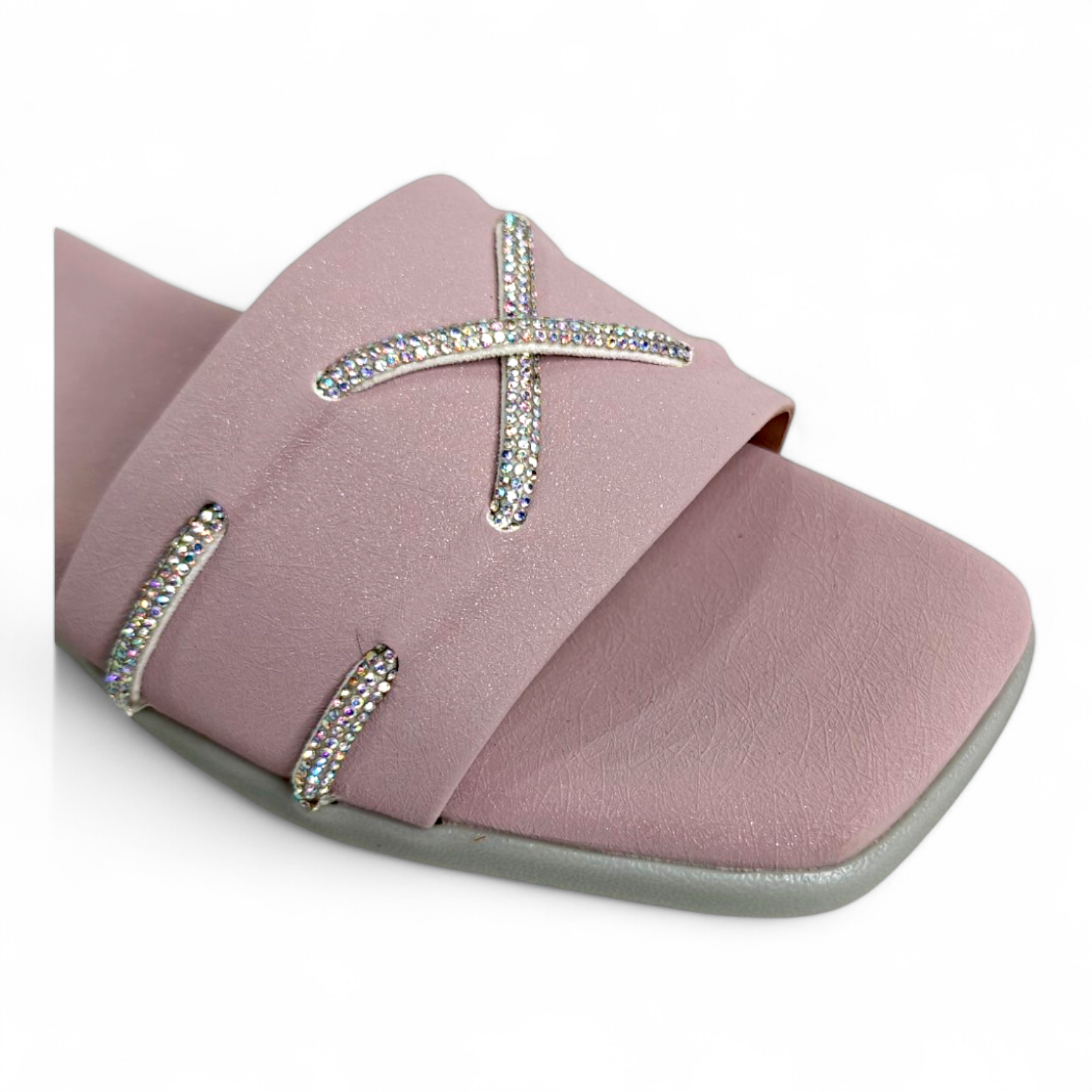 Close-up of 2 diamond cross strips on lilac open toe flats sliders