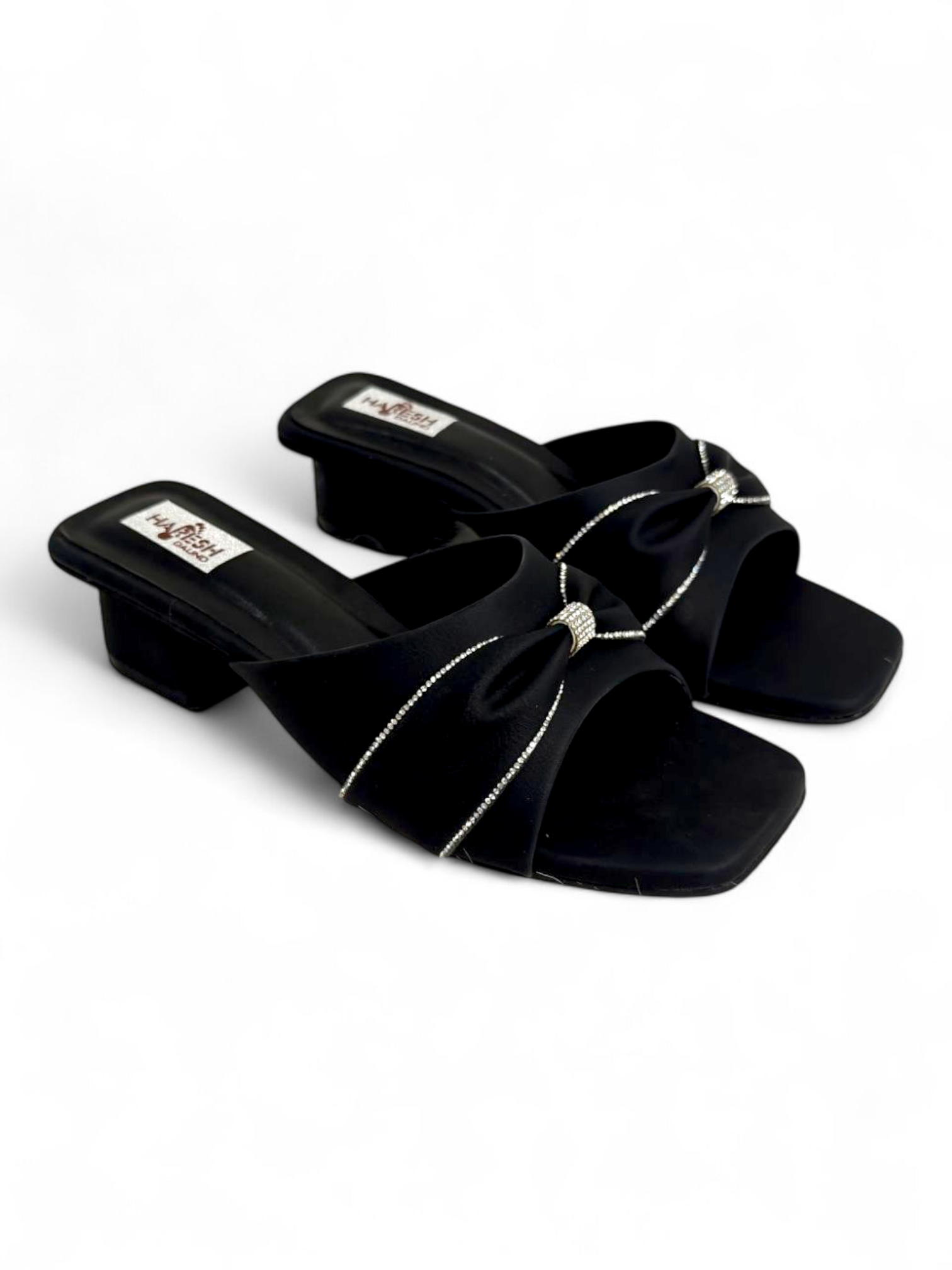 Top angle showing knot strap and soft footbed of black women’s block heels