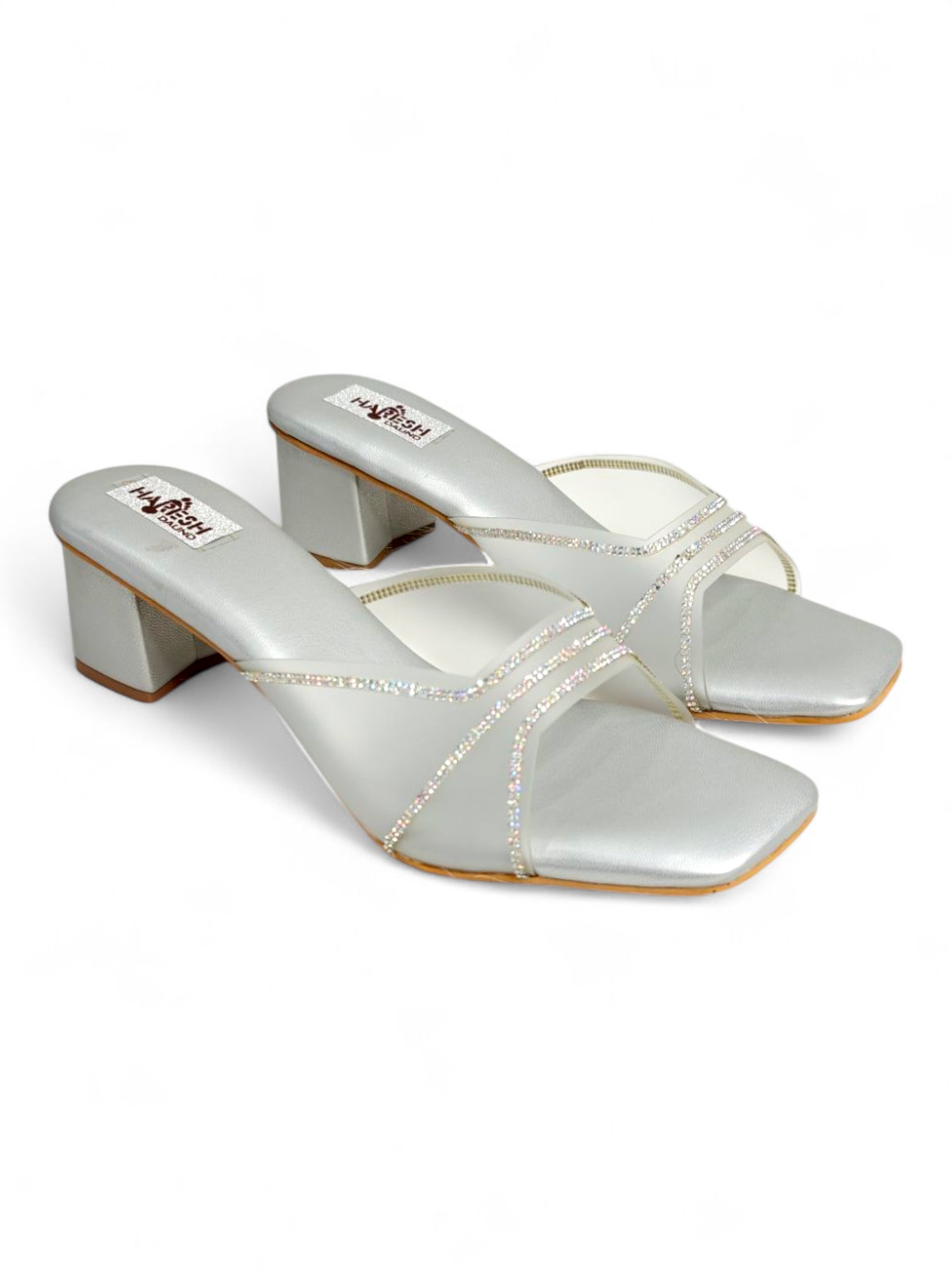 Top view showing criss-cross shimmer strap design on silver sandals