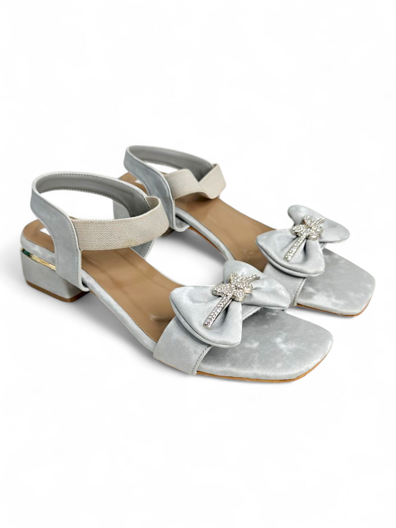 Gold-accented block heel on silver women's party wear sandals