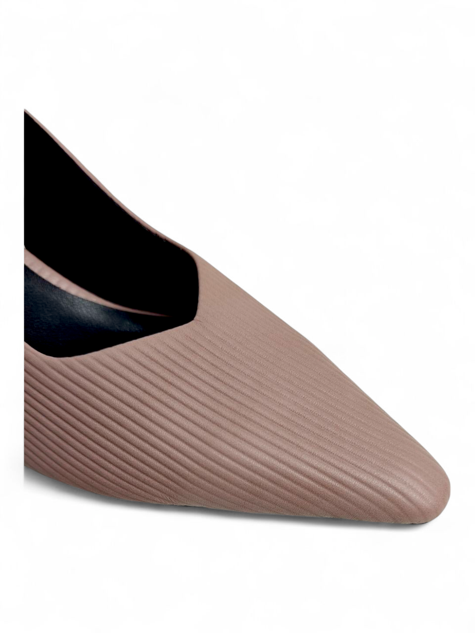 Close-up of textured pattern and pointed-toe finish on nude slingback heels