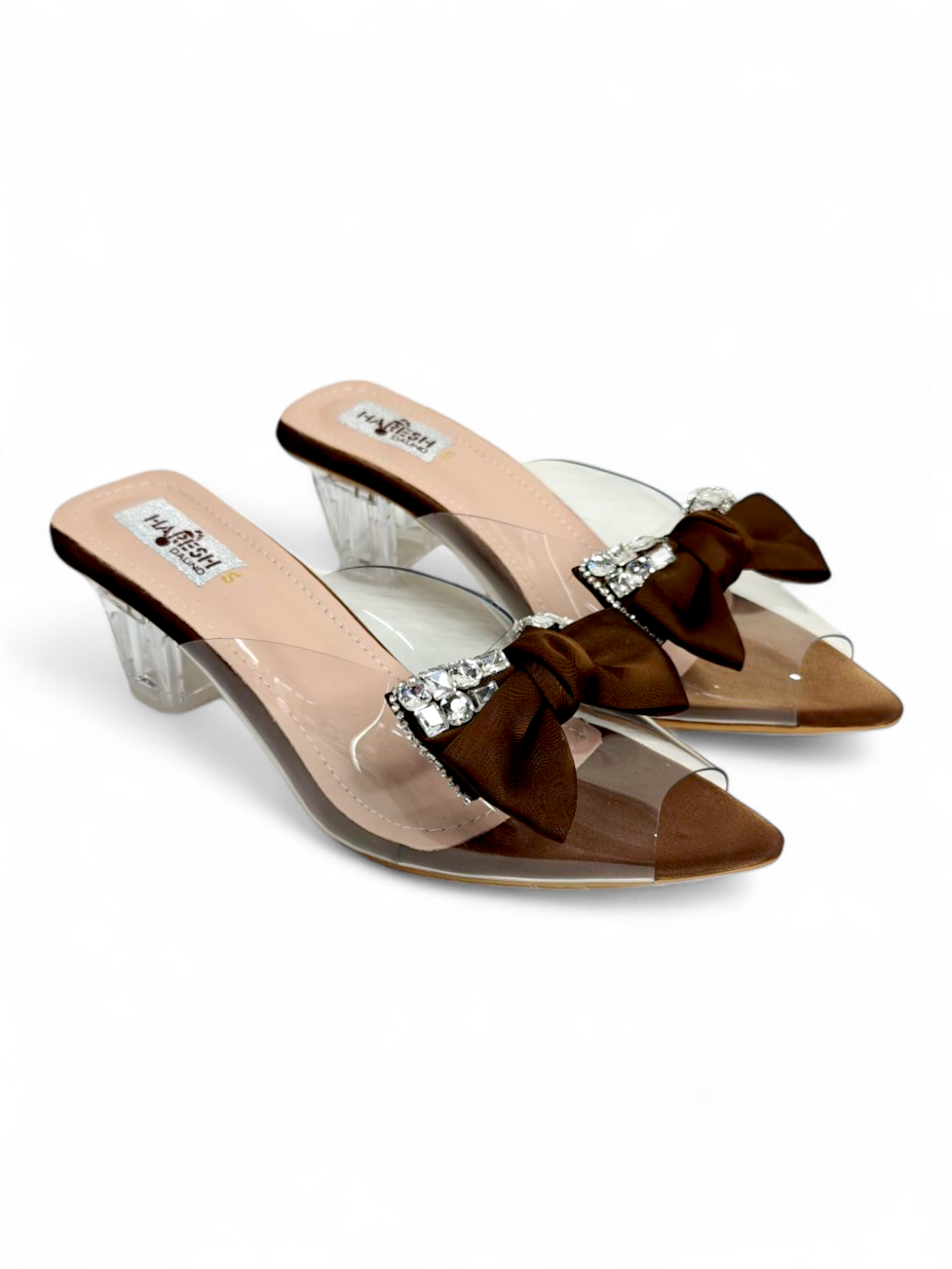 Top view of transparent strap wedge sandals with brown bow embellishment