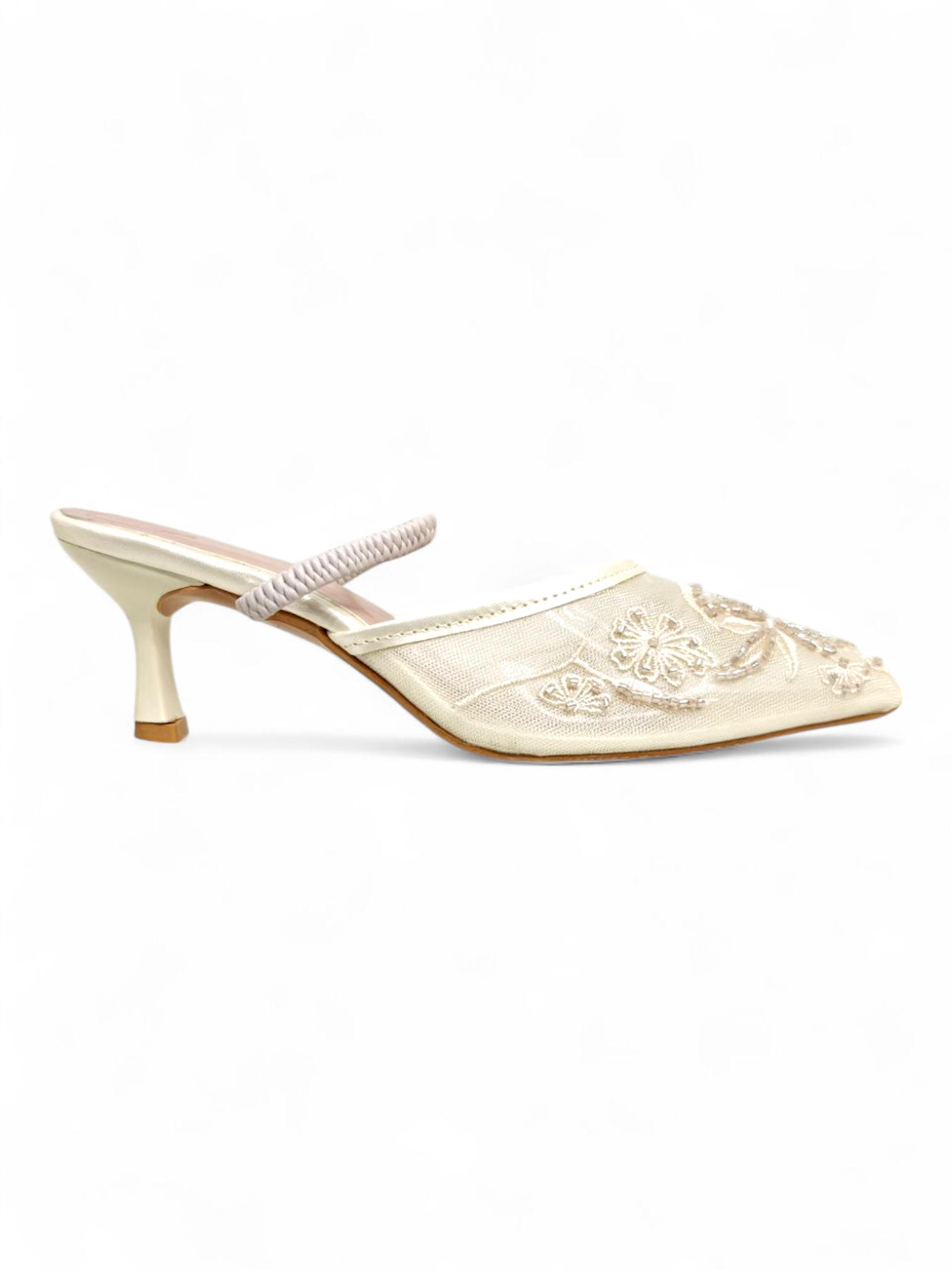 Side profile of cream floral embroidered mesh mule heels with pointed toe