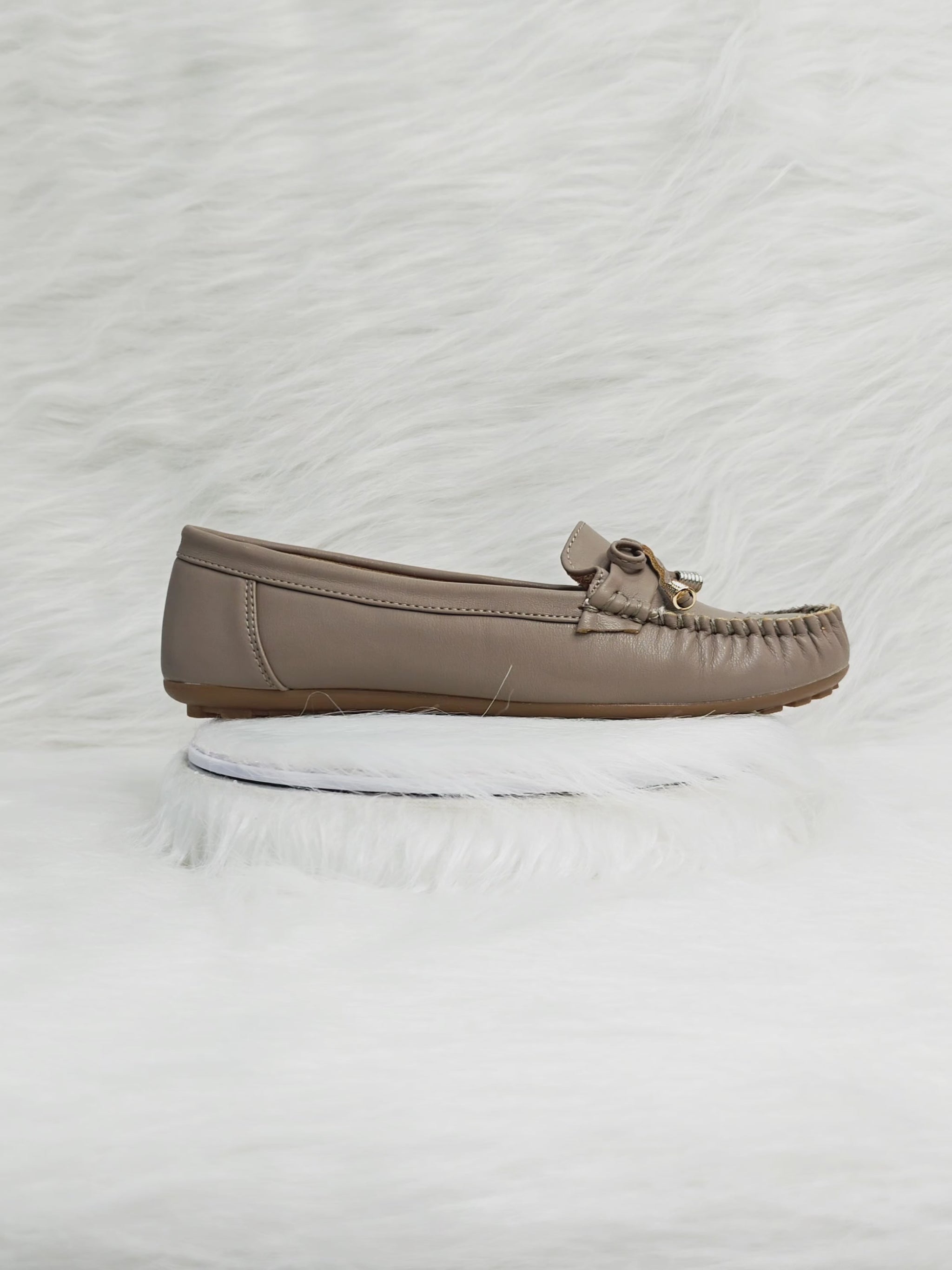 Video showing taupe women’s loafers highlighting soft sole, stitched detailing, and comfortable fit for everyday Indian wear.