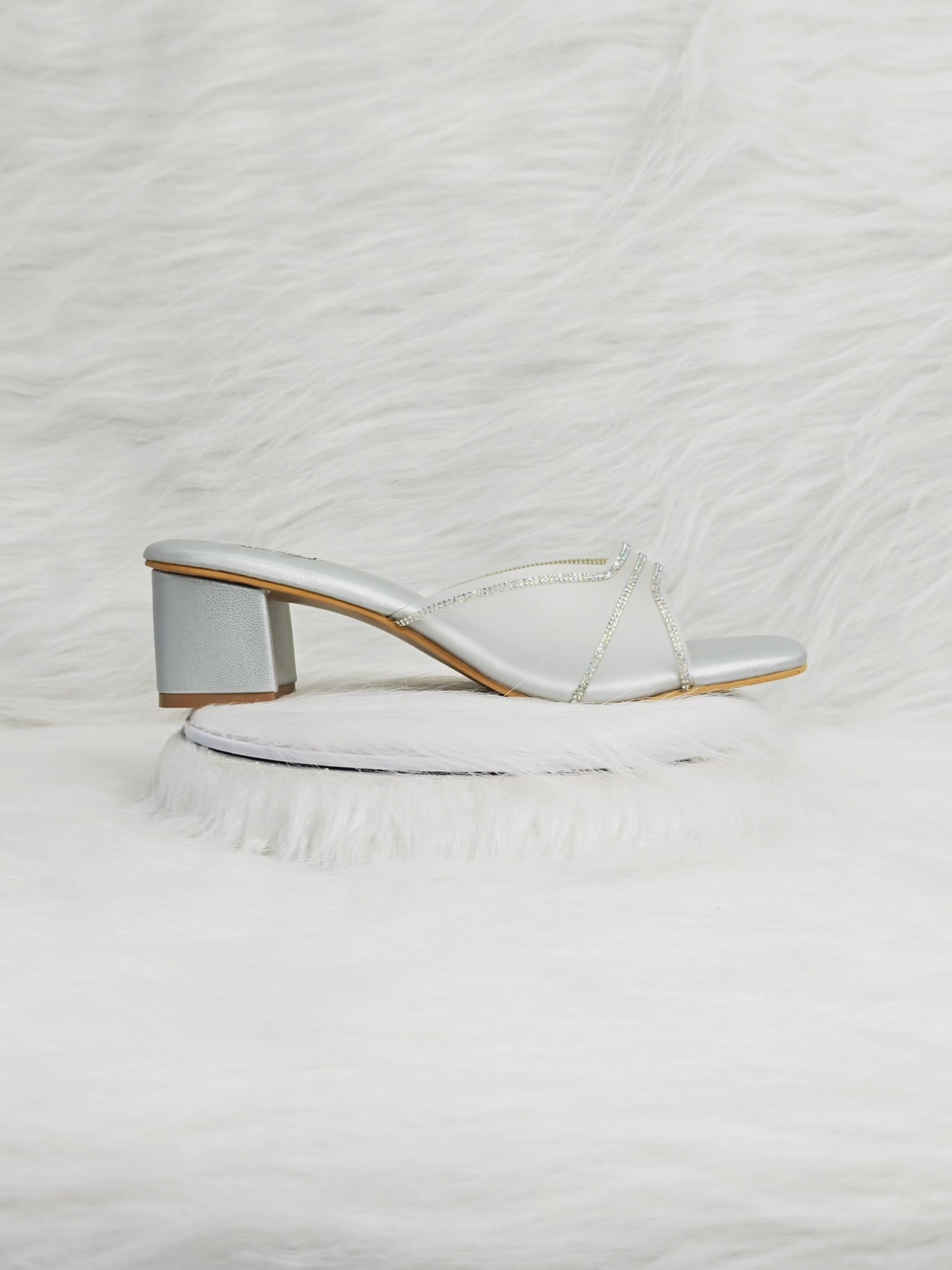 360 degree rotation of silver criss-cross shimmer strap low block heel sandals for women