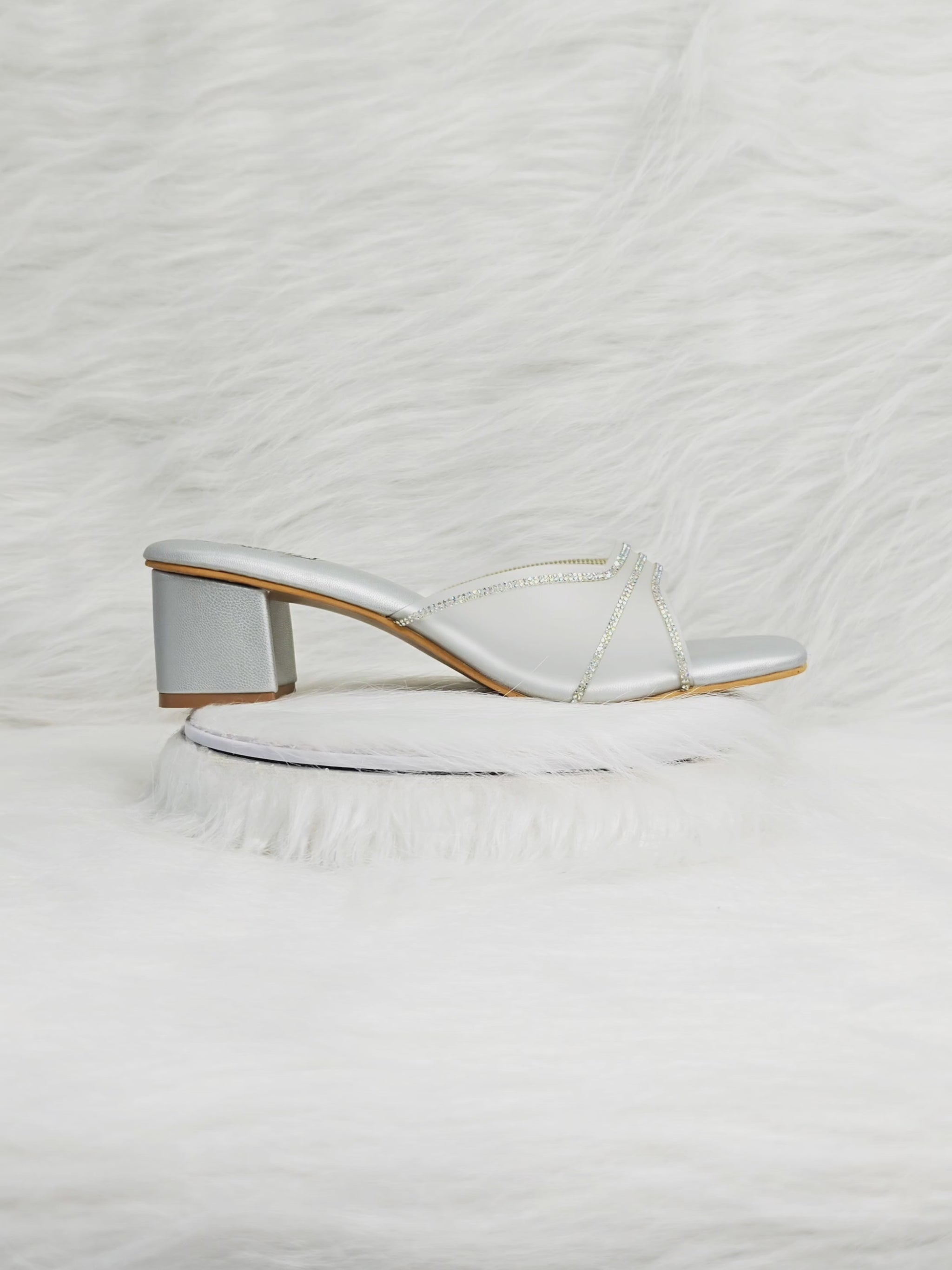 360 degree rotation of silver criss-cross shimmer strap low block heel sandals for women