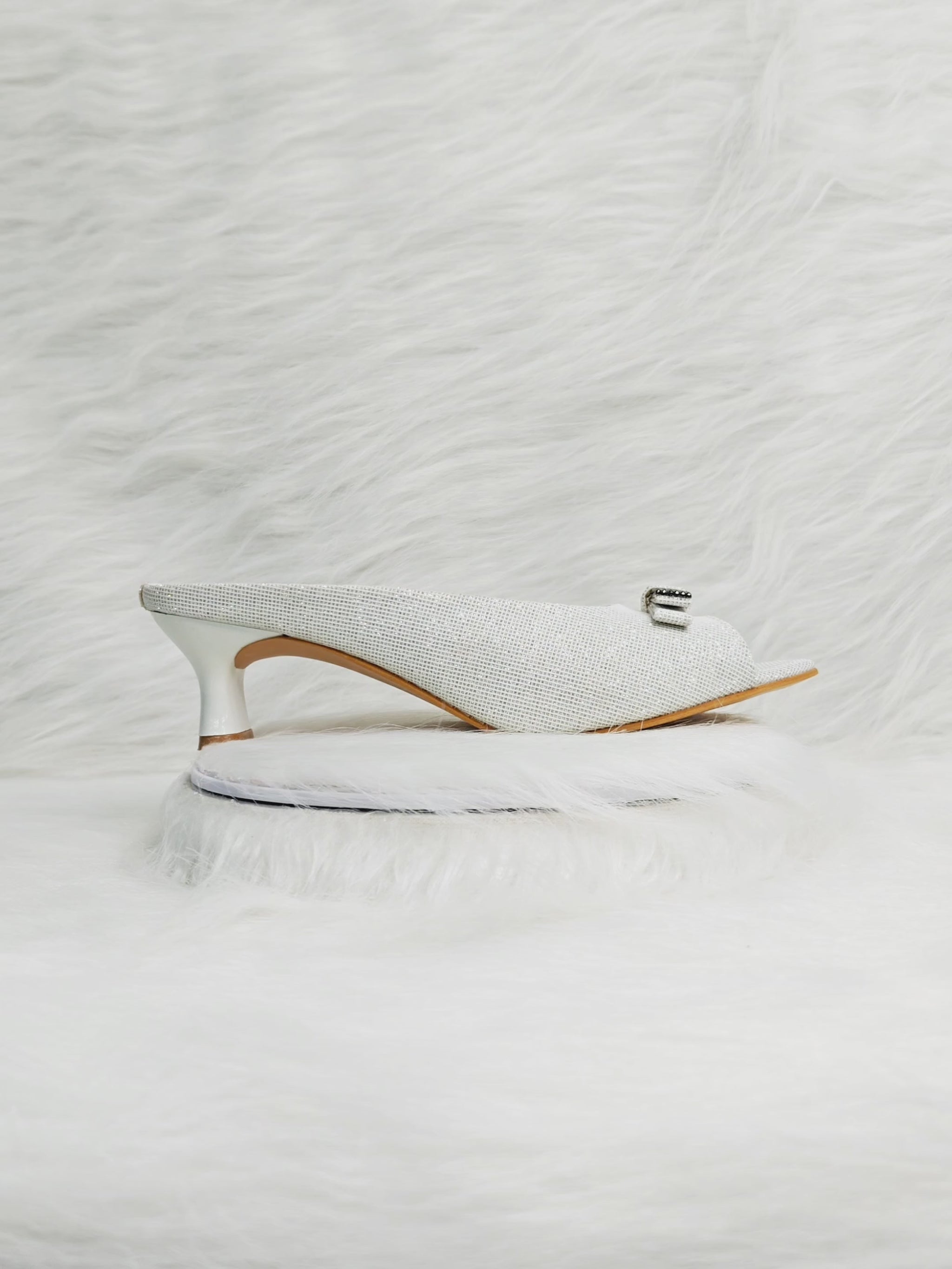 360 degree rotation of white textured peep-toe kitten heel sandals with buckle for women