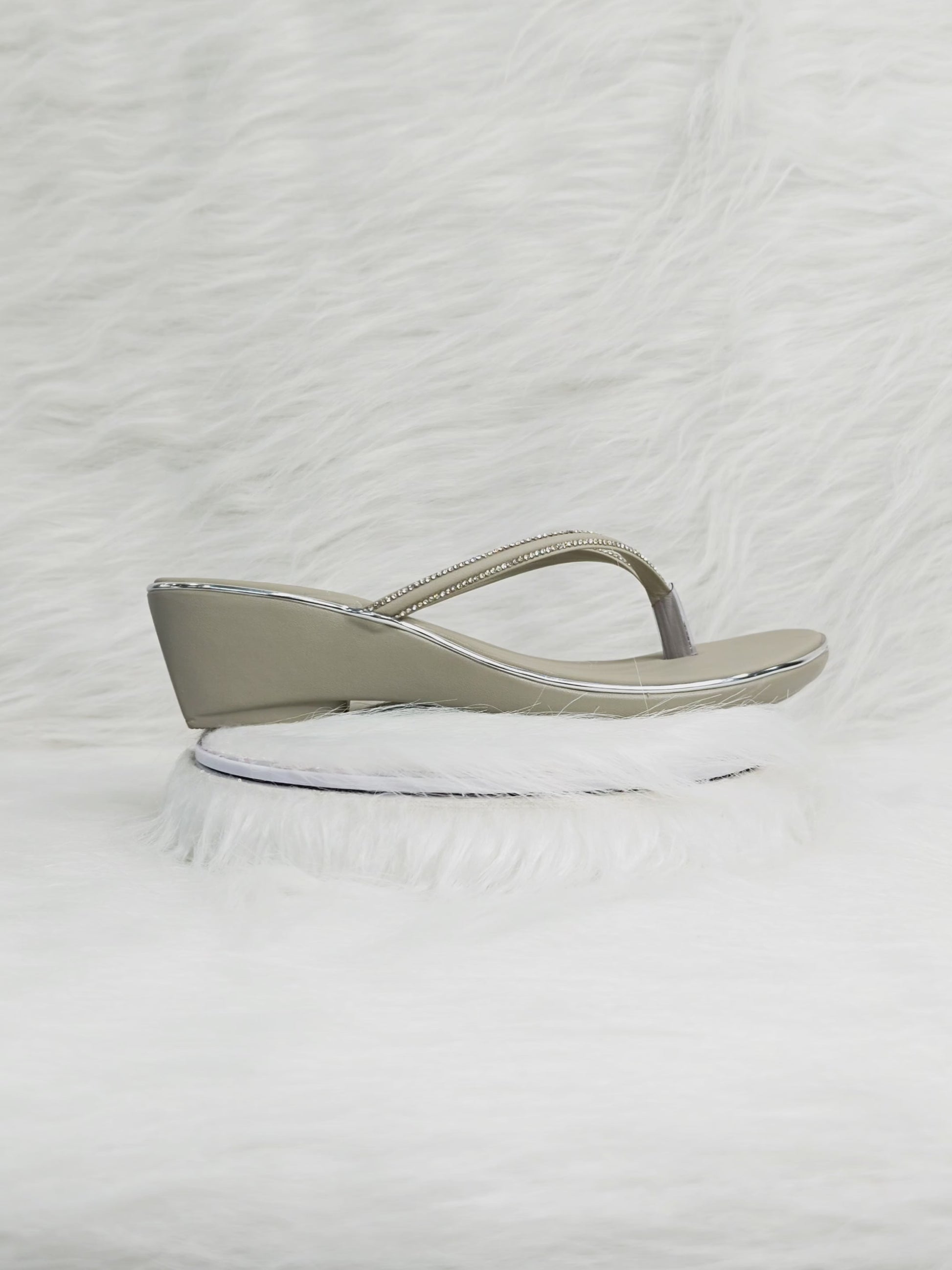 A close-up and walking shot of grey rhinestone wedge thong sandals showing sparkle, flexibility, cushioned sole and low-wedge comfort suitable for Indian festive wear.