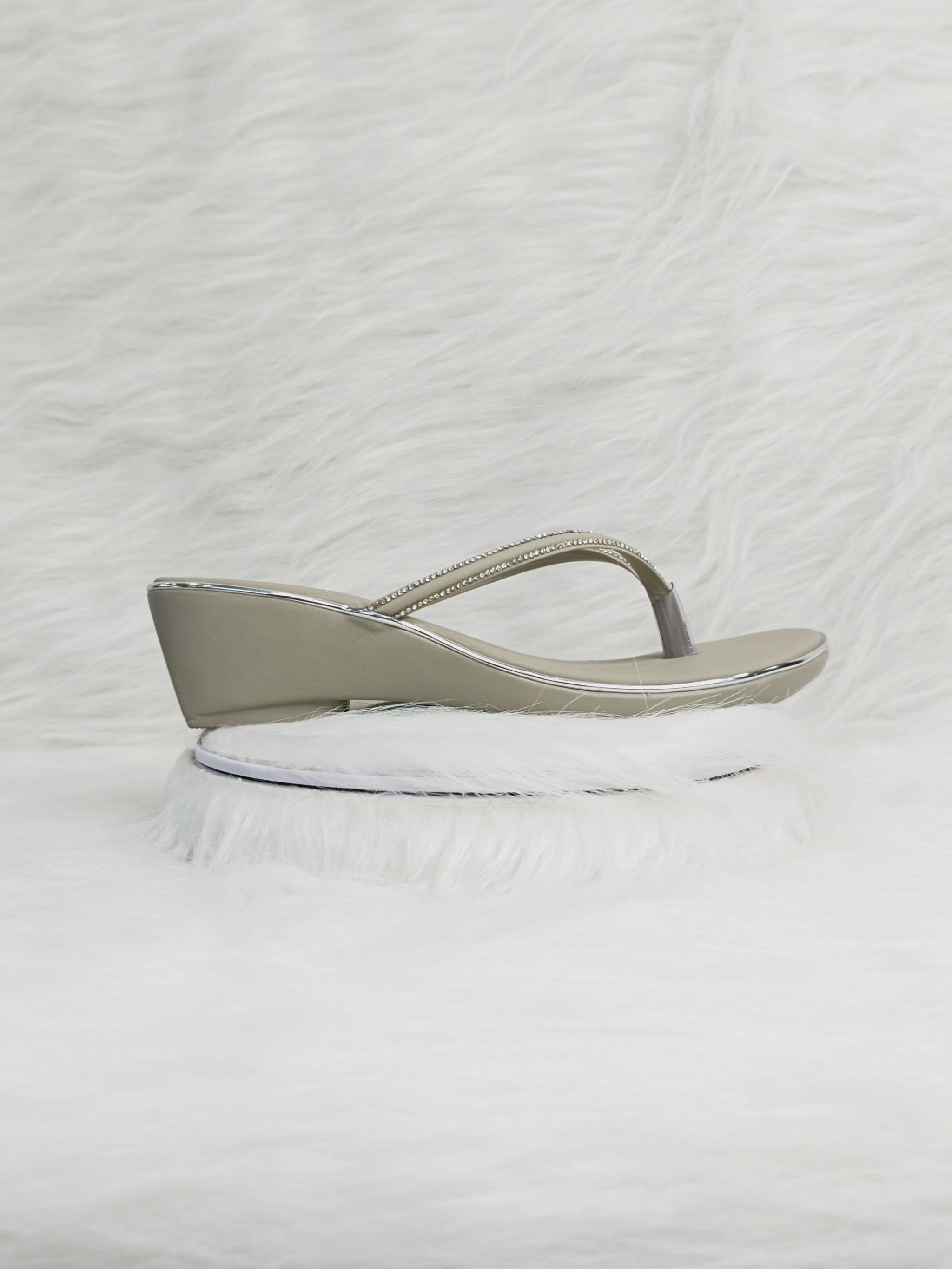 A close-up and walking shot of grey rhinestone wedge thong sandals showing sparkle, flexibility, cushioned sole and low-wedge comfort suitable for Indian festive wear.